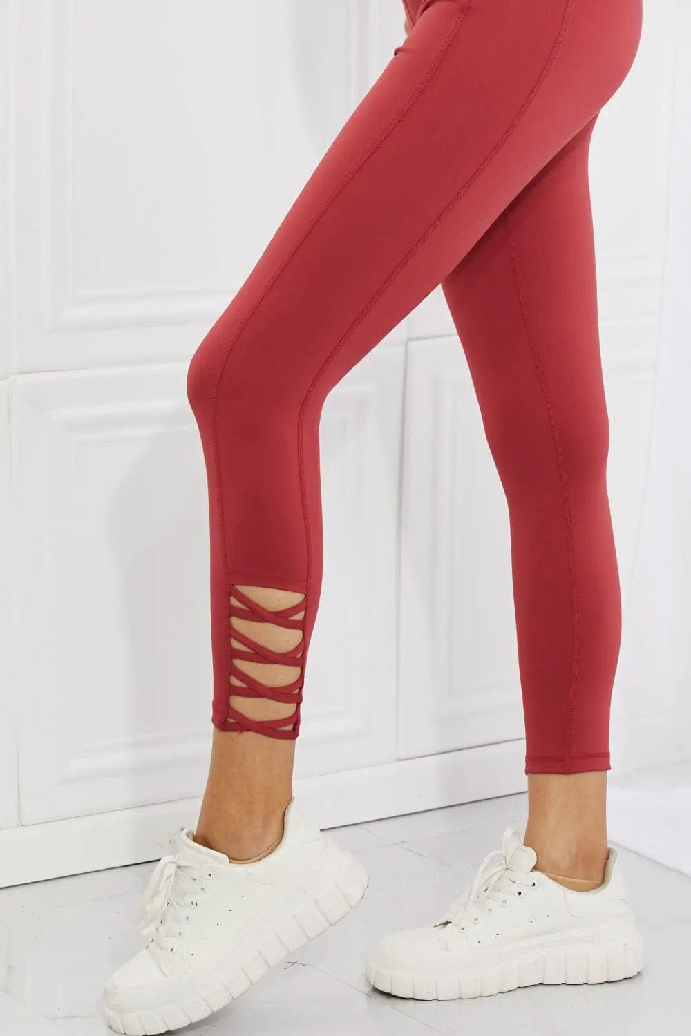 Yelete Ready For Action Full Size Ankle Cutout Active Leggings in Brick Red  31.00 MPGD Corp Merchandise